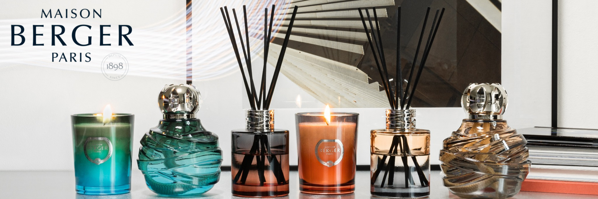 A line up of Maison Berger products. Candles, diffusers, and lamps